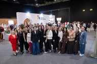 Foto de familia en el stand de Talento Almeriense de la Semana Internacional de la Moda Flamenca de Sevilla.