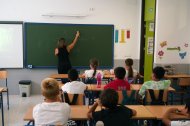 Niños en el aula en su primer día de clase tras la vacaciones de verano.