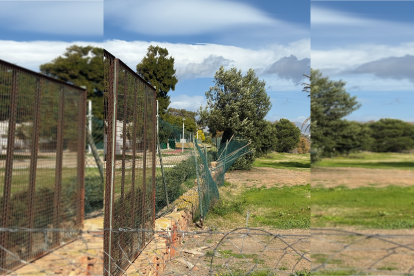 Vista del vallado roto y caído en los solares municipales