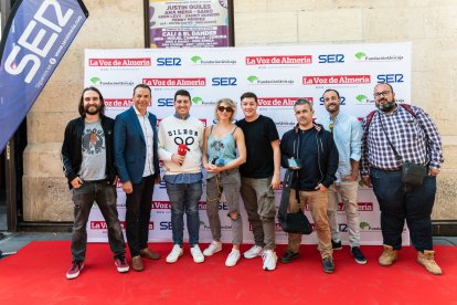 Compañeros de los medios de comunicación que acudieron al evento para dar cobertura a la presencia de la ministra en la capital almeriense.