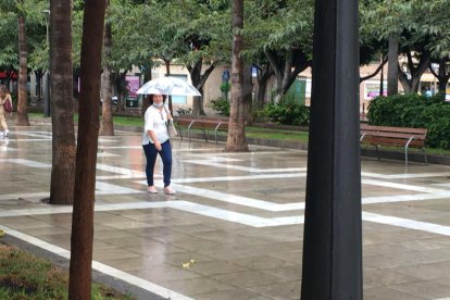 Mascarillas y paraguas, los complementos de esta jornada.