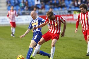 Saveljich en una jugada con Toquero.