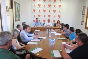 Reunión con comerciantes del Poniente