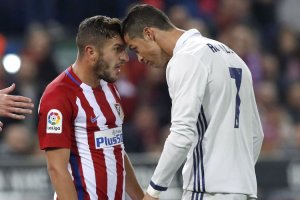 Koke y Cristiano cada a cara.