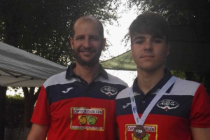 El campeón con su entrenador.