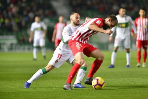 Saveljich con Iván Sánchez en el Elche-Almería.