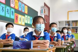 Niños chinos en una clase en Pekín - XINHUA
