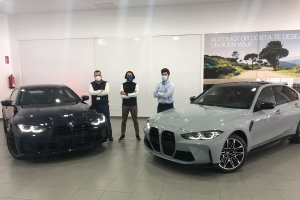 Componentes del equipo de ventas de Automotor Costa junto a los potentes BMW Competition