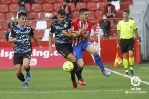 De la Hoz con Djuka en el partido de la pasada Liga.