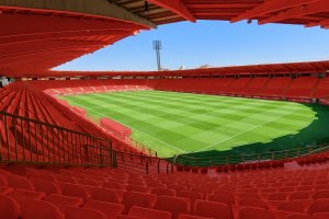 Imagen de ChatGPT sobre cómo quedaría el Estadio 'Reino de León' con las butacas rojas tras el ascenso a Segunda División.