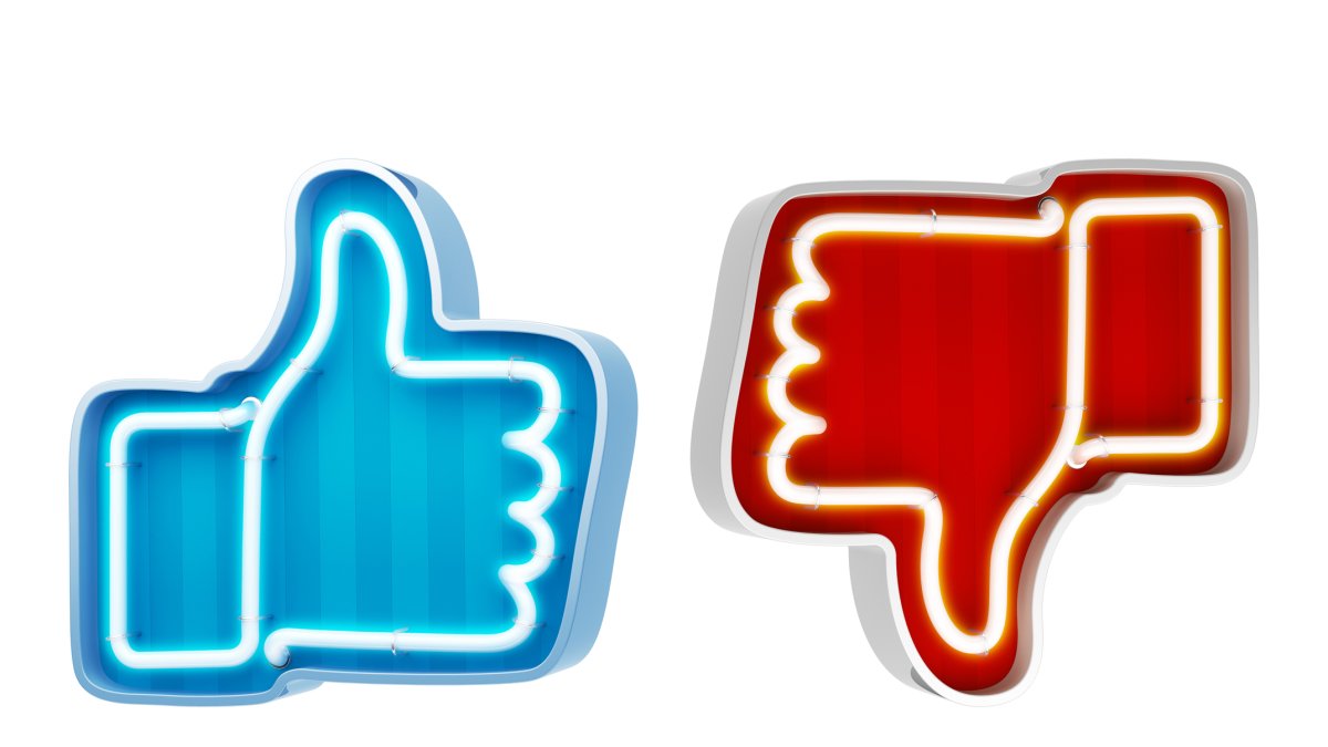 Los símbolos de like y dislike simbolizan las interacciones de las redes sociales