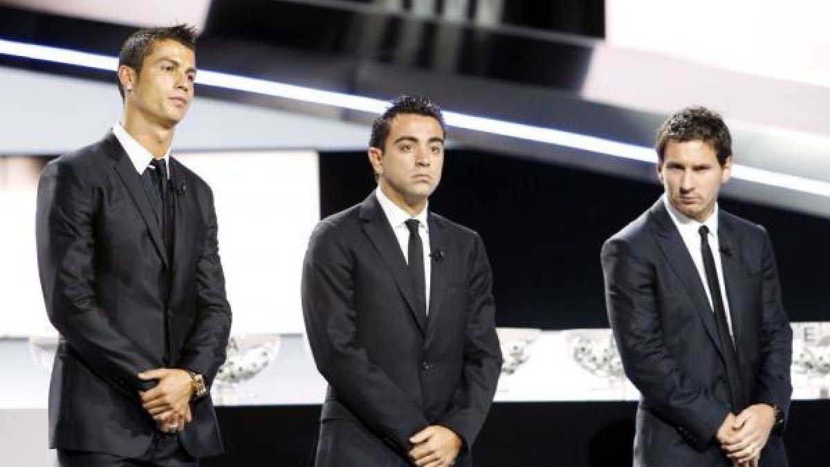 Xavi con Messi y Cristiano.