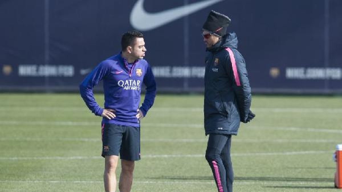 Xavi con su míster.