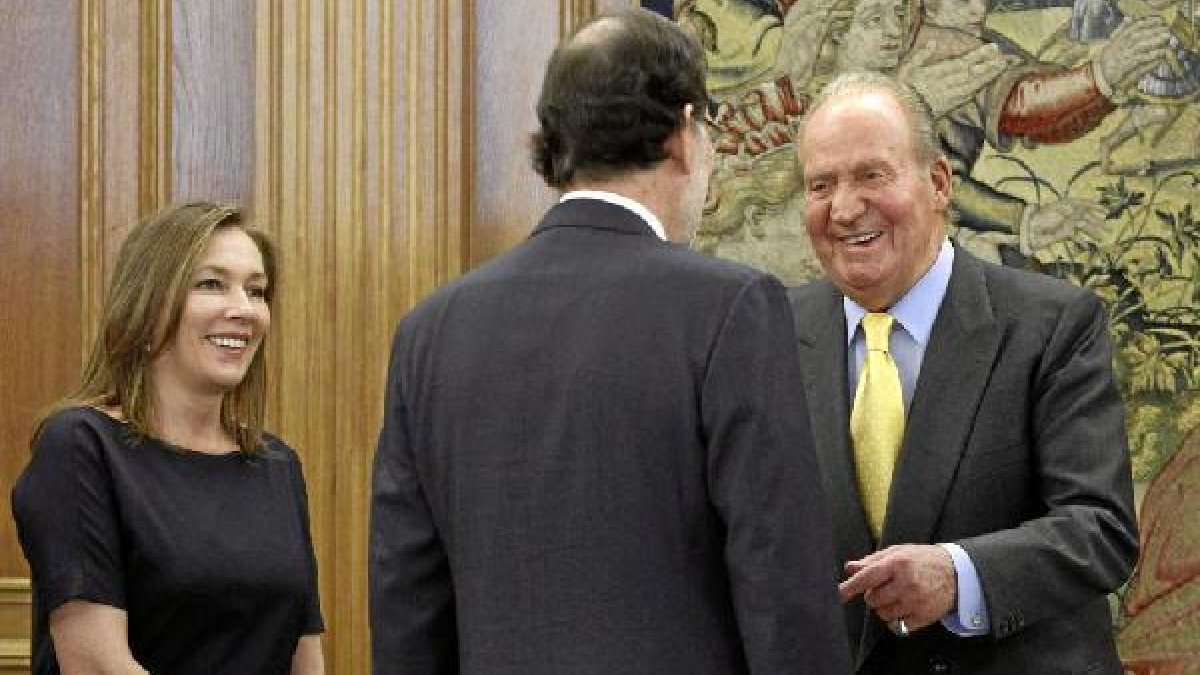 Rajoy y el Rey de España.o,469px);}</