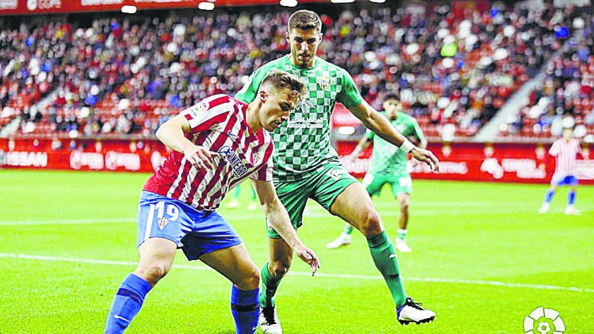 Bogdan y Babic en el encuentro de El Molinón.