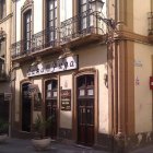 Una imagen de la fachada de Casa Puga en la calle Real