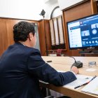 Juanma Moreno, durante la videoconferencia con representantes del sector agroalimentario.