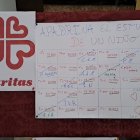 Cartulina con los lotes disponibles para apadrinar el arranque escolar de los pequeños.