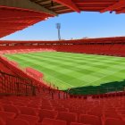 Imagen de ChatGPT sobre cómo quedaría el Estadio 'Reino de León' con las butacas rojas tras el ascenso a Segunda División.
