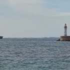 El buque Duque de Ahumada, junto al faro del Puerto de Almería, fotografiado desde El Zapillo.